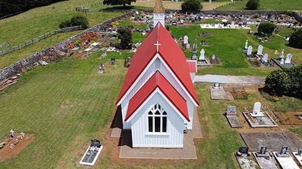 Aerial view of St Michael's church with headstones surrounding
